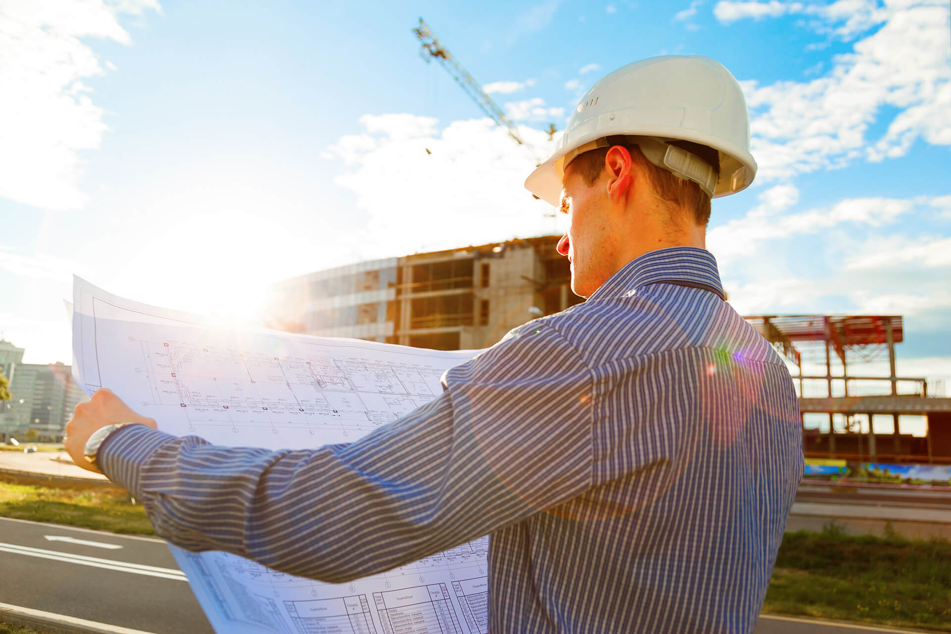 Construction Project Management - Construction Foreman reading blueprints